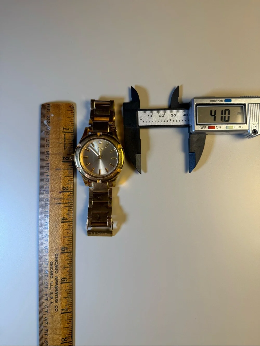 Nixon “High Maintenance” The Camden gold-tone watch w/ real diamond marker.